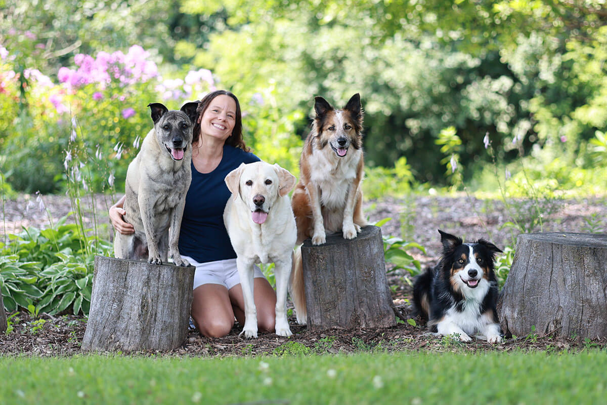 Debi with her 4 dogs.
